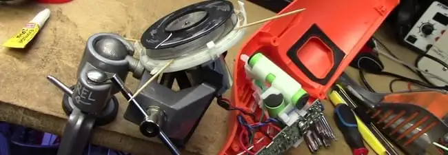 Vacuum cleaner repair parts and tools on a workbench in Baton Rouge, LA